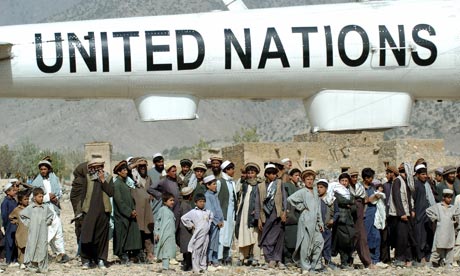 Afghan villagers with a UN helicopter in 2004