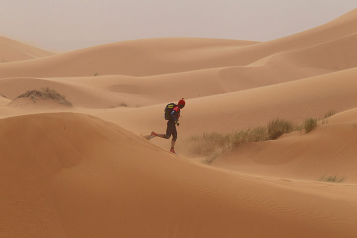 24 hours in pictures: A competitor crosses the erg Znaigui, Morocco
