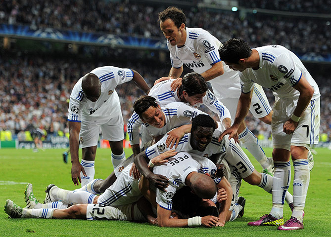 Real Madrid v Tottenham: Angel Di Maria is buried under team-mates as they celebrate his goal