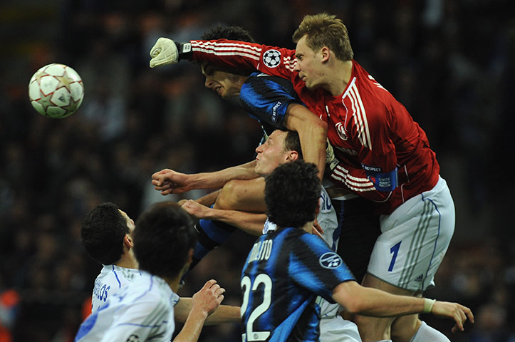 Inter v Schalke: Schalke keeper Manuel Neuer beats Andrea Ranocchia to the ball