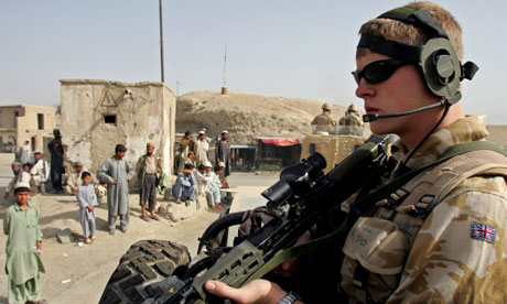 A British soldier patrols the outskirts of Kabul