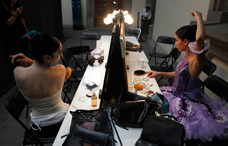 24 hours in pictures: Dancers from Mexico's National Dance Company prepare backstage