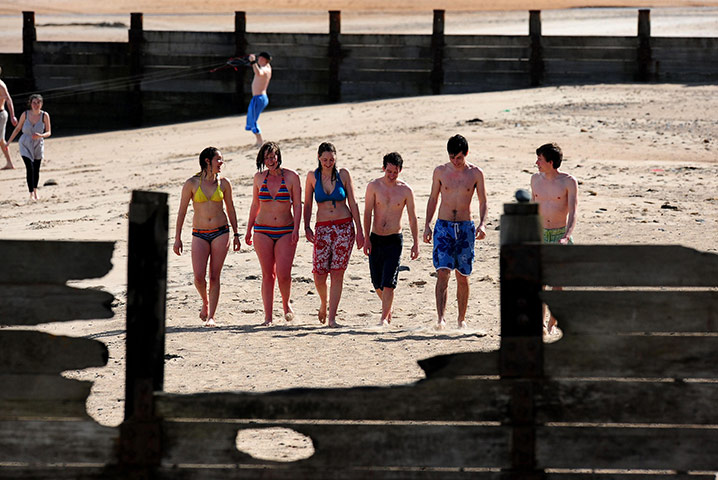 April Hot Weather: People walk down Blyth beach in Northumberland