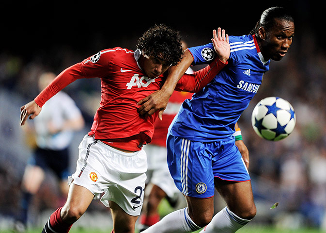 Chelsea v United: Didier Drogba holds off the challenge from Rafael