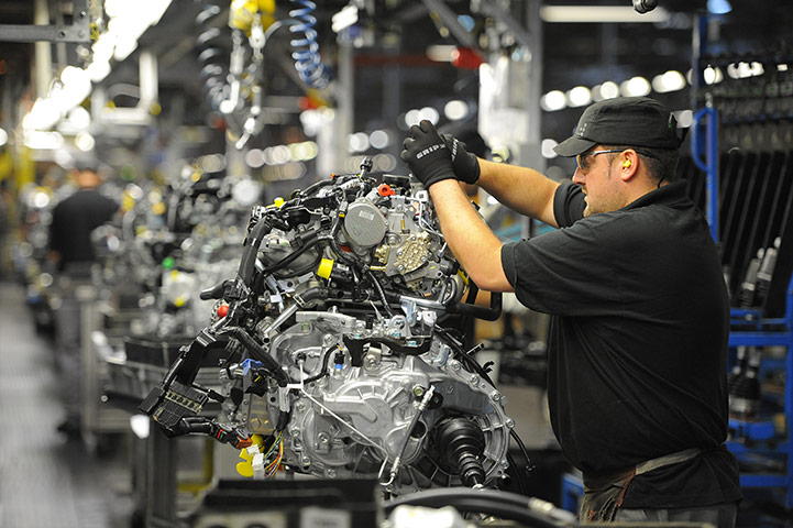 Week in Business: A man works on an engine at the Nissan car plant in Sunderland