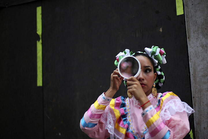 24 hours in pictures: A woman dressed as an Adelita in Mexico City