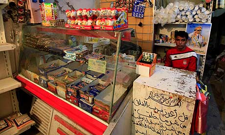 A man sits in his shop in the old city of Tripoli