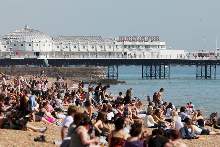 April Hot Weather: Sunbathers enjoy the sunshine in Brighton