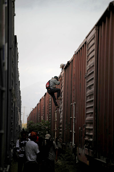 24 Hours in Pictures: Migrants get off a train on their journey toward the US-Mexico border