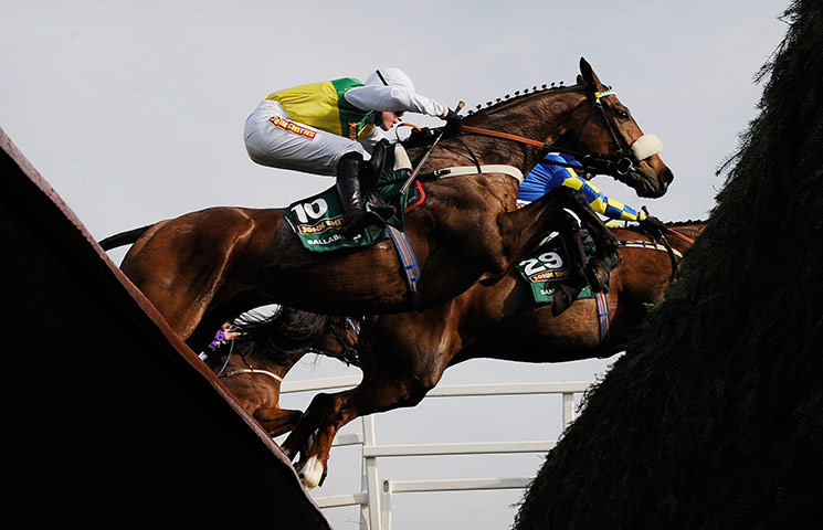 Grand National: Jason Maguire on Ballabriggs jumps the huge ditch in front of The Chair