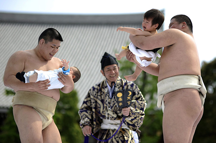 24 hours: Tokyo, Japan: Babies held by amateur sumo wrestlers burst into tears