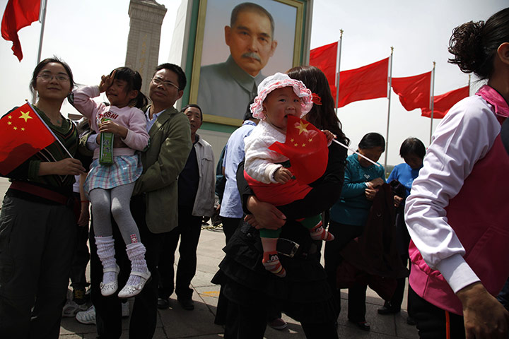 24 hours: Beijing, China: Visitors to Tiananmen Square pose for photos 