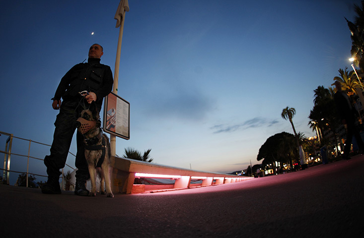 24 hours in pictures: Private security officer stands guard at Carlton Hotel beach in Cannes