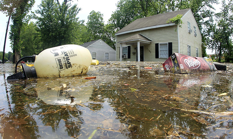 Memphis floods: Trash floats by flooded homes