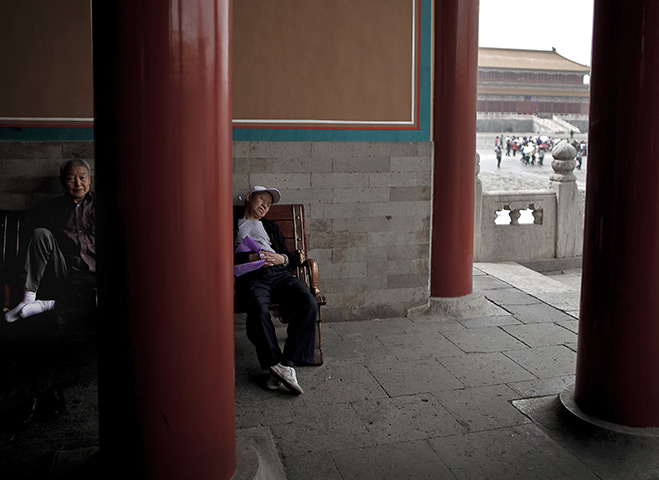 24 hours : Beijing, China: Chinese tourists take a rest inside the Forbidden City