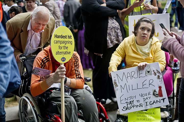 Hardest Hit march: Wheelchair users with placards