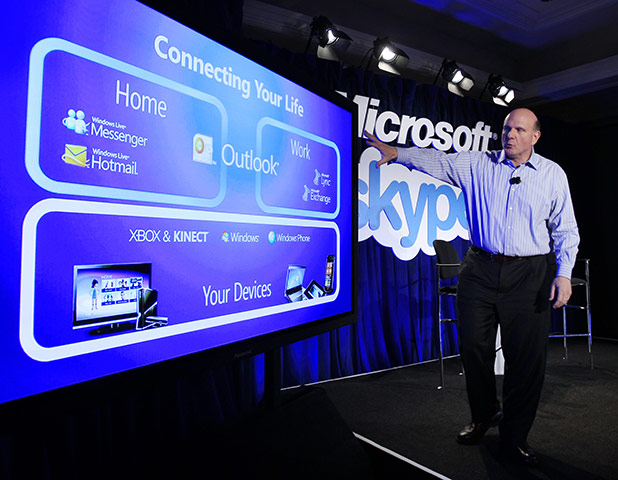 Week in Business: Microsoft CEO Steve Ballmer gestures during a news conference