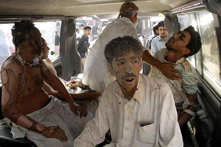 Pakistan Bomb Attacks: People injured in suicide bomb attacks are rushed to hospital in Peshawar
