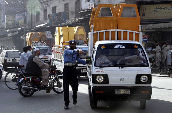 Pakistan Bomb Attacks: Rescue workers transport coffins of the victims of suicide bombs, Pakistan