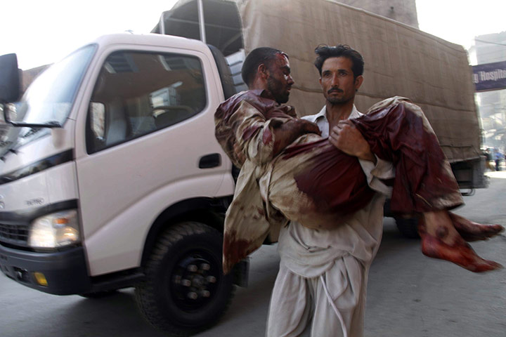 Pakistan Bomb Attacks: An injured man is rushed to a hospital in Peshawar, Pakistan