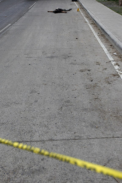 24 hours in pictures: A man lies dead in Tegucigalpa