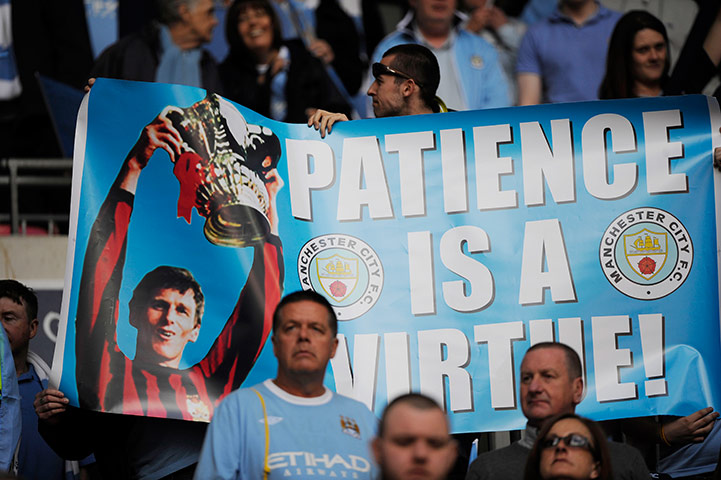 FA Cup Final City v Stoke: Manchester City fans with a banner