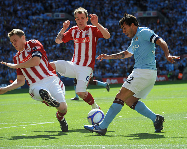 FA Cup Final City v Stoke: Tevez finds some space and crosses past Shawcross and Whelan