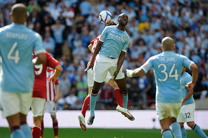 FA Cup Final City v Stoke: Yaya Toure wins a header from Dean Whitehead