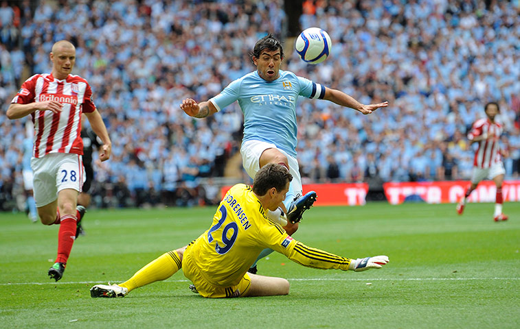 FA Cup Final City v Stoke: Tevez takes the ball past Sorensen but his shot goes wide