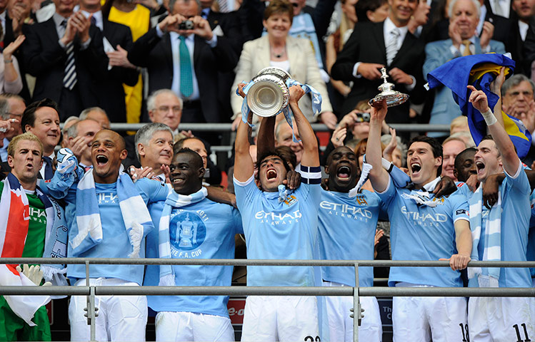 FA Cup Final City v Stoke: Carlos Tevez lifts the trophy & the blue half of Manchester erupts with joy