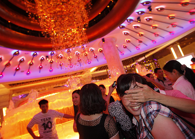 24 hours: Macau, China: Mainland Chinese visitors react in the Galaxy Macau