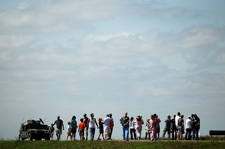 24 hours: Morganza, Louisiana, USA: Residents watch as water is released