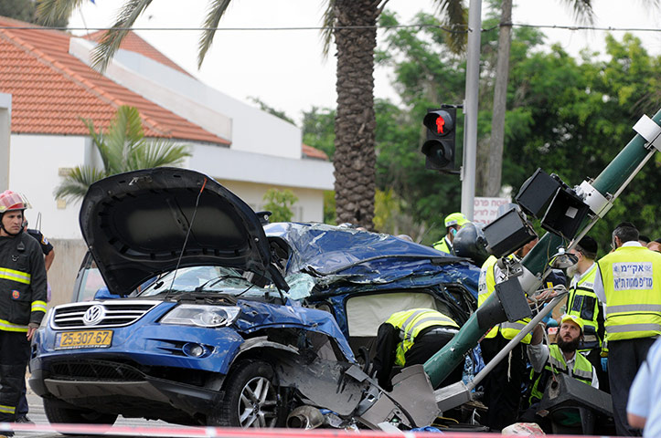 Israel violence: Israeli rescue teams inspect the scene of an attack in Tel Aviv