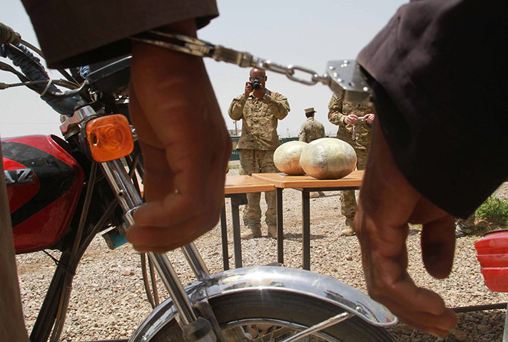 24 hours in pictures: Afghan police arrest drugs smugglers