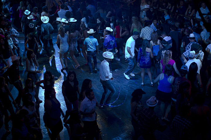 Pointy Boots: A man wears long pointy boots as he dances