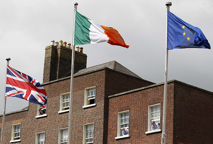 Queen in Ireland: Office workers look from windows as Queen Elizabeth arrives in Dublin