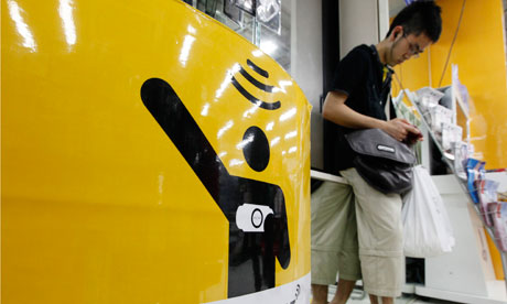 A man plays Sony's PlayStation portable at a PlayStation spot in Tokyo