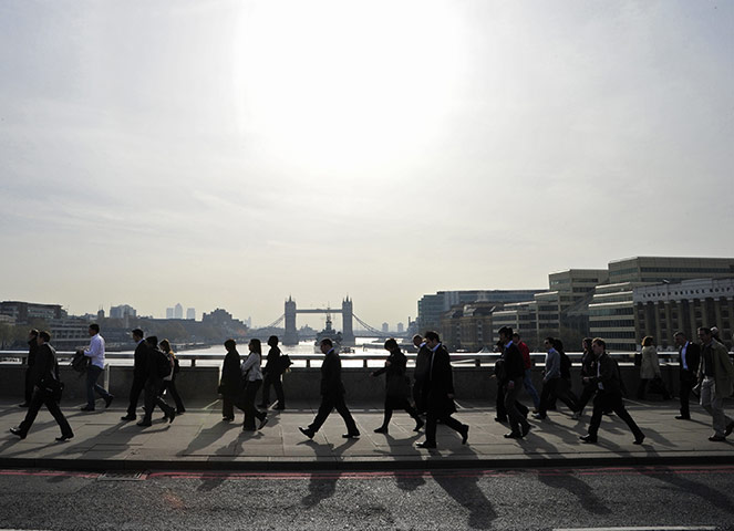 Business Week: City workers cross London Bridge
