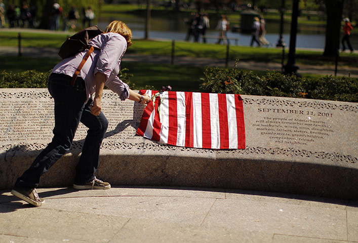 Bin Laden US reaction: A woman looks at the names of victims etched on the memorial 