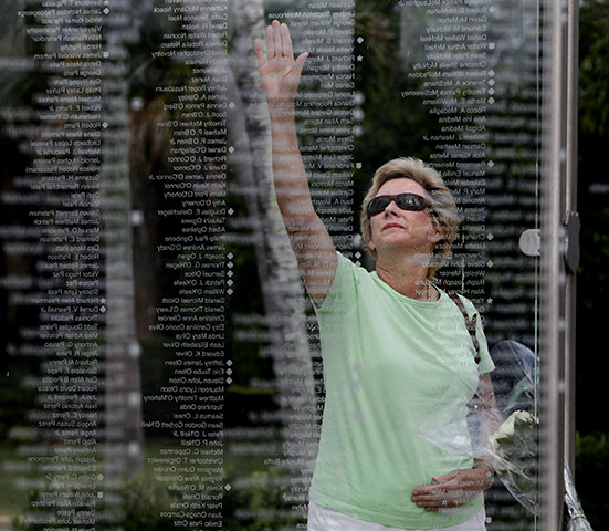 Bin Laden US reaction: A woman reaches up to touch the name of her daughter