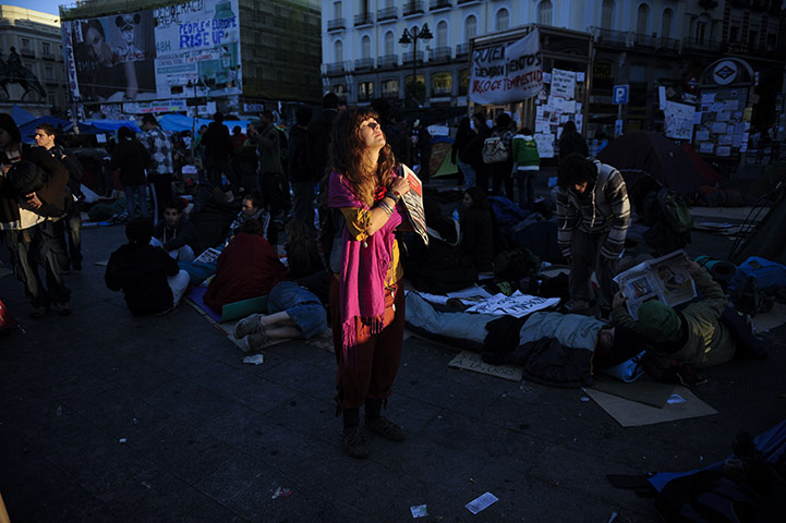 24 hours in pictures: Demonstrators occupy the Puerta del Sol square in Madrid