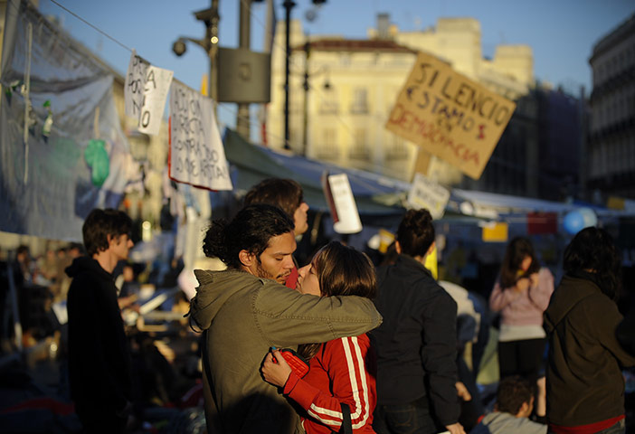 Spain protests: two protesters embrace