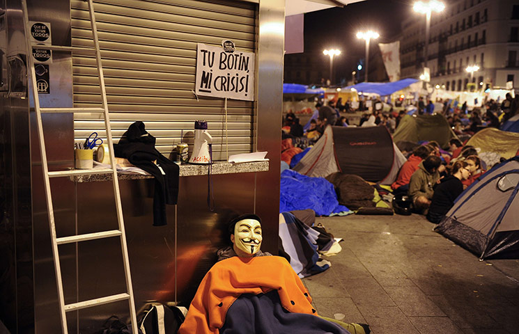 Spain protests: a demonstrator in a Guy Fawkes mask