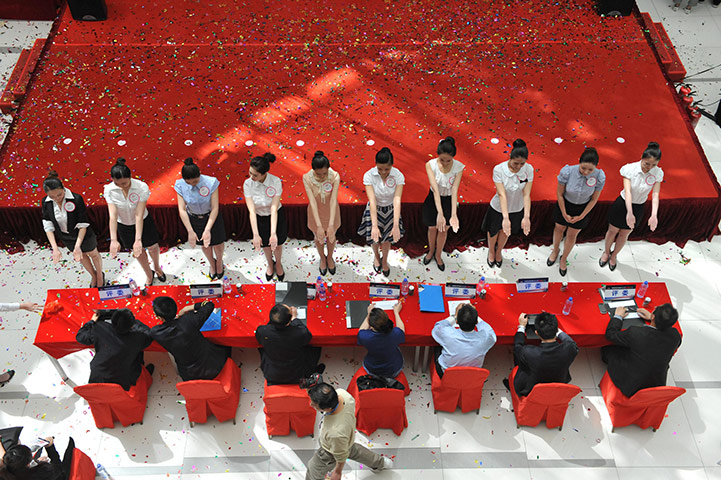 24 hours in pictures: hopeful flight attendants in China