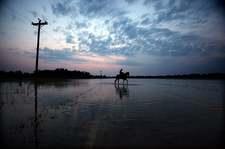 24 hours in pictures: Rising Rivers And Tributaries Continue To Flood Southern Communities