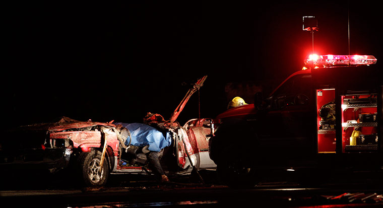 US tornado: A body is seen in a tornado ravaged car in Joplin