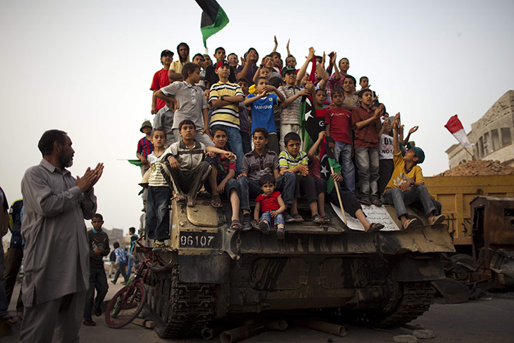24 hours: Misrata, Libya: Children watch a cultural event organised by the rebels