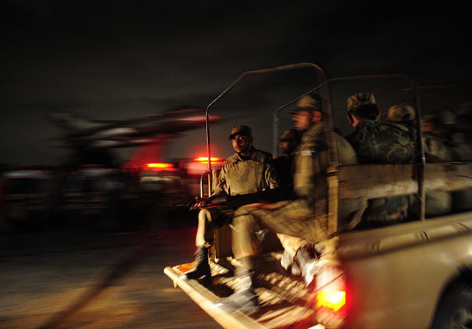 24 hours: Karachi, Pakistan: Pakistani soldiers enter naval air base after an attack