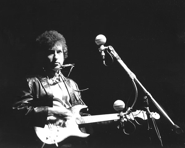 Bob Dylan at 70: Bob Dylan plays an electric guitar for the first time at Newport, 1965