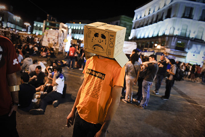 Spain protests continue: Protester attends a demonstration, Puerta del Sol square